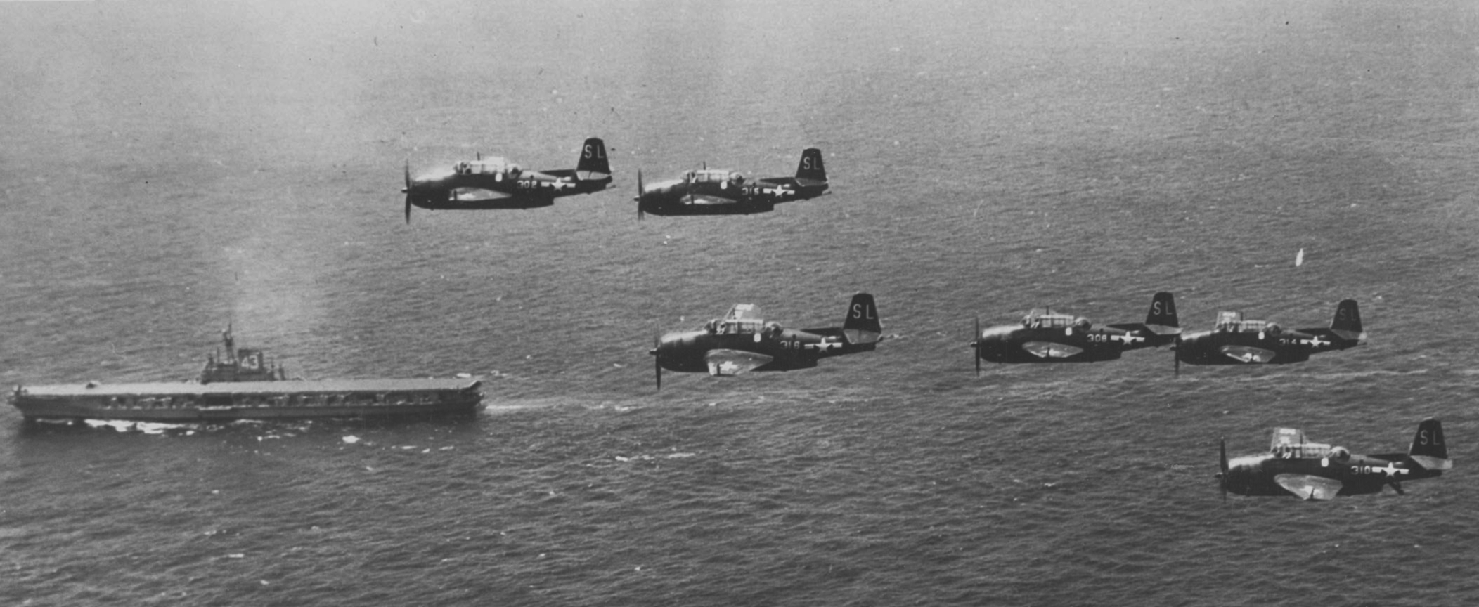 TBF/M's fly by the USS Coral Sea